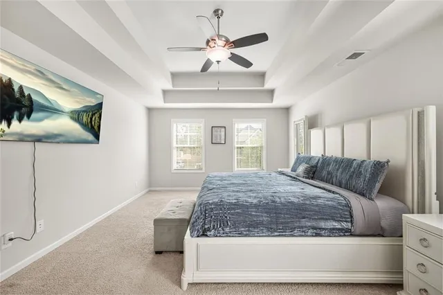 a bathroom with a sink a large mirror and a bathtub