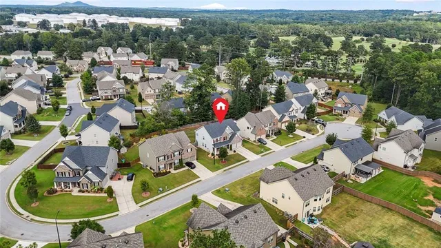 an aerial view of house with yard swimming pool and mountain view
