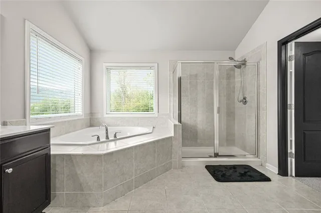 a bedroom with a bed and a television