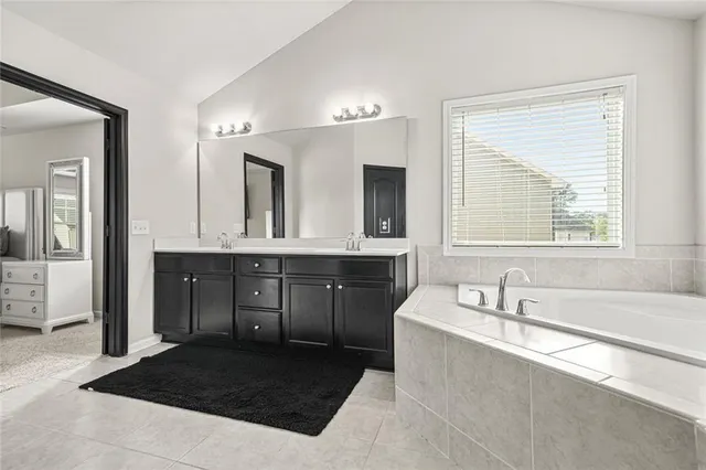 a bedroom with bed and a window