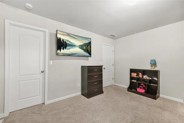 a picture of floor with a white wall and white walls