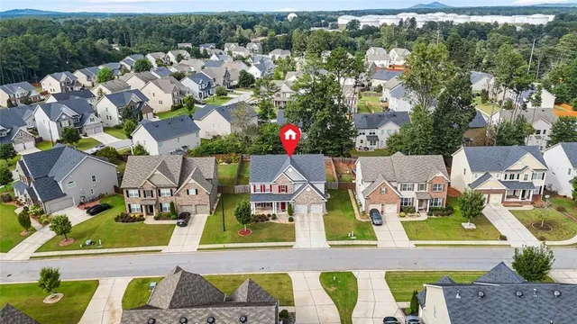 a view of a house with a backyard