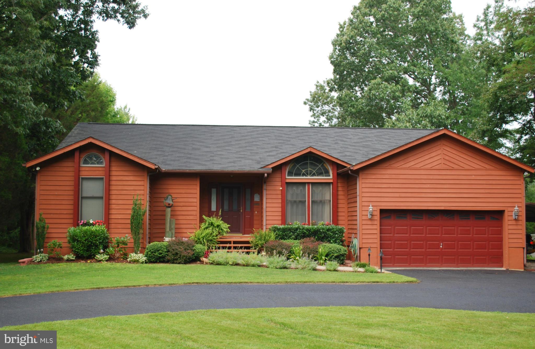 Extremely well maintained Cedar sided Rambler!