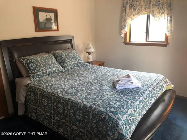 a bathroom with a toilet a sink and bathtub