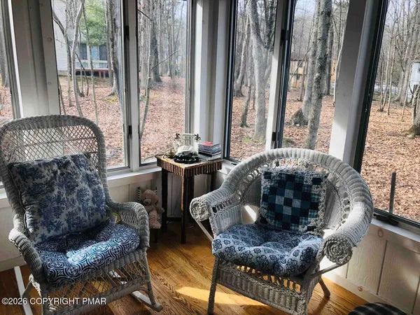 a living room with furniture and a rug
