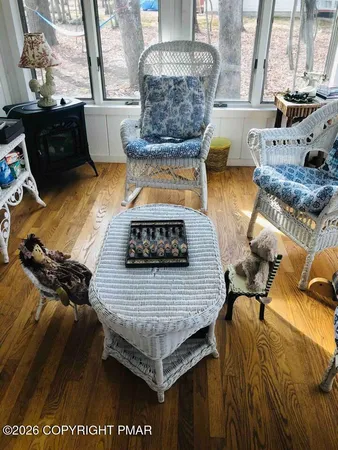 a bedroom with a bed and painting on the wall