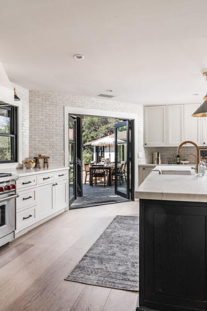 1383 School House Road Santa Barbara, CA 93108 - Photo 3 of 10 a kitchen with sink stove and cabinets