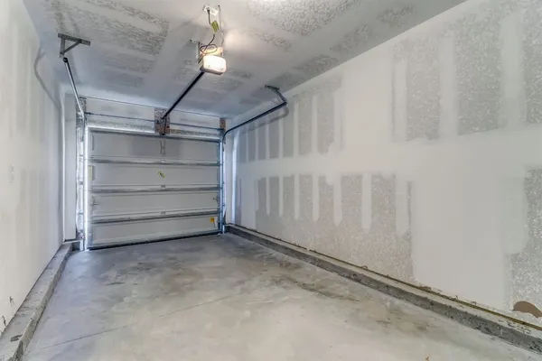 a view of an empty room with a white walls