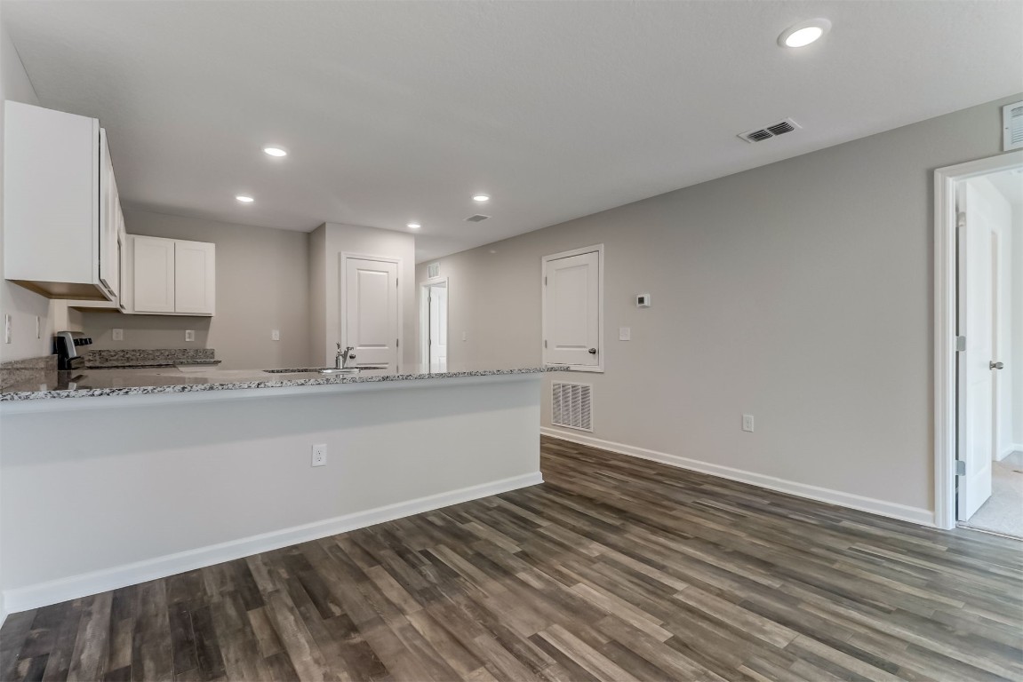 45177 Red Brick Drive Callahan, FL 32011 - Photo 3 of 13 a view of kitchen with granite countertop cabinets and wooden floor