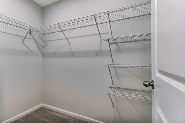 a view of a room with racks on the wall