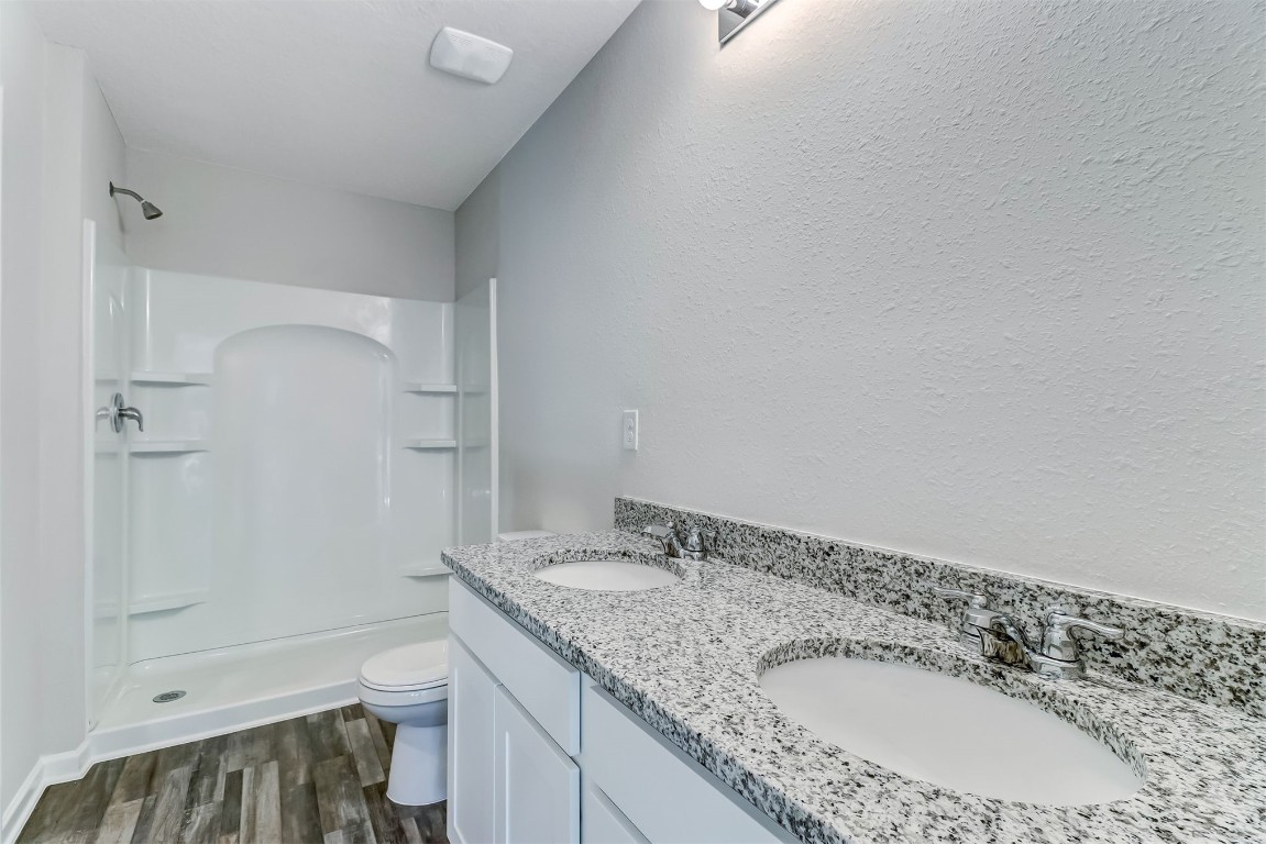 45177 Red Brick Drive Callahan, FL 32011 - Photo 10 of 13 a bathroom with a granite countertop sink and a mirror