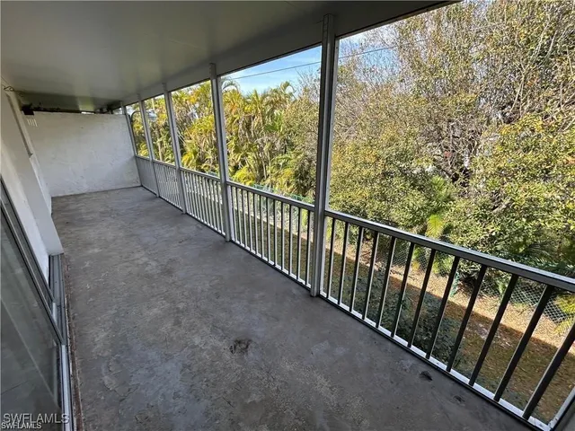 a view of a swimming pool and an outdoor seating