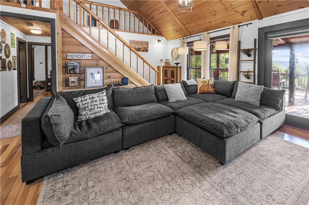 832 Scenic Mountain View Road Blue Ridge, GA 30513 - Photo 6 of 56 a living room with furniture and a large window