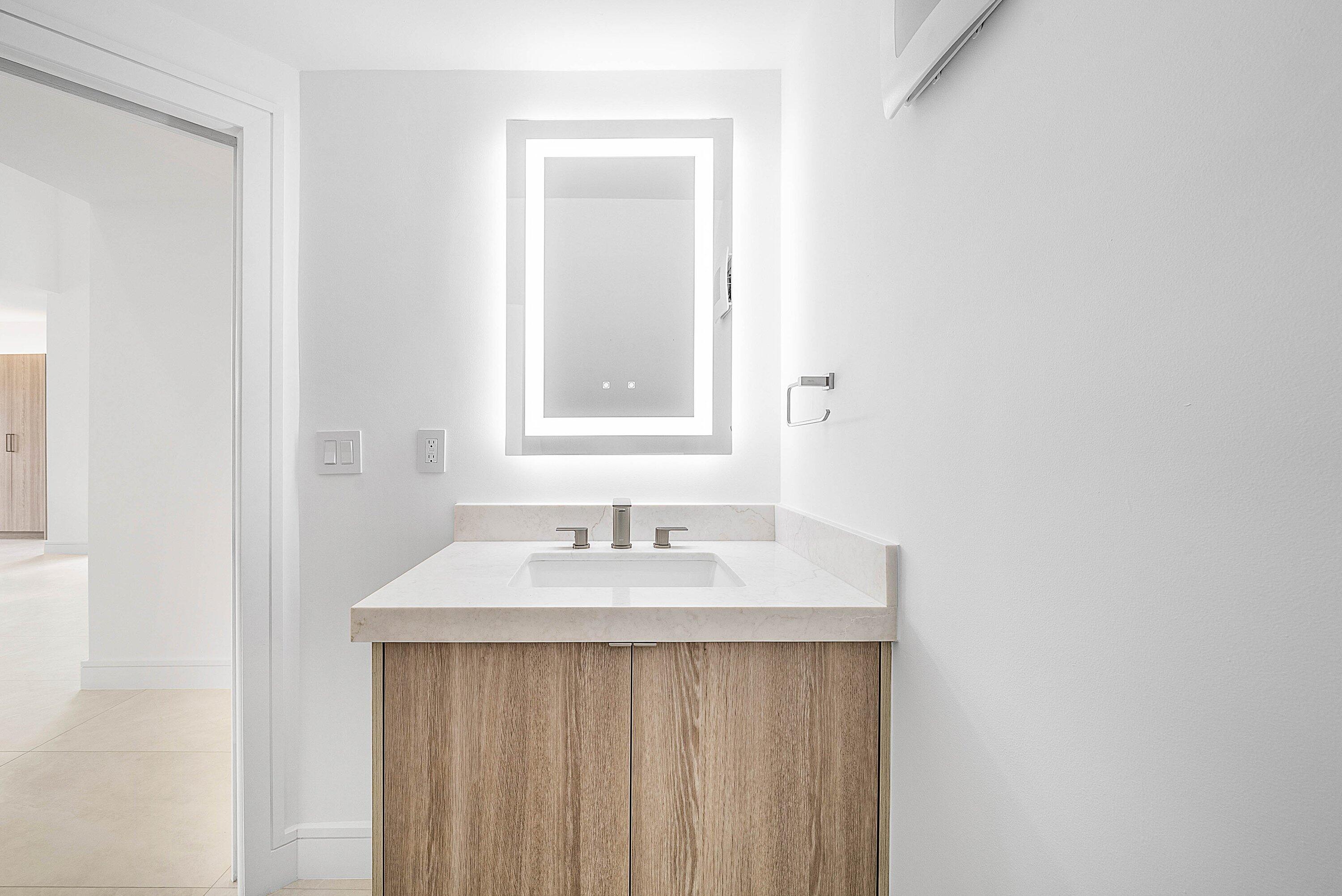 6547 Via Rosa Boca Raton, FL 33433 - Photo 18 of 55 a bathroom with a sink and a mirror