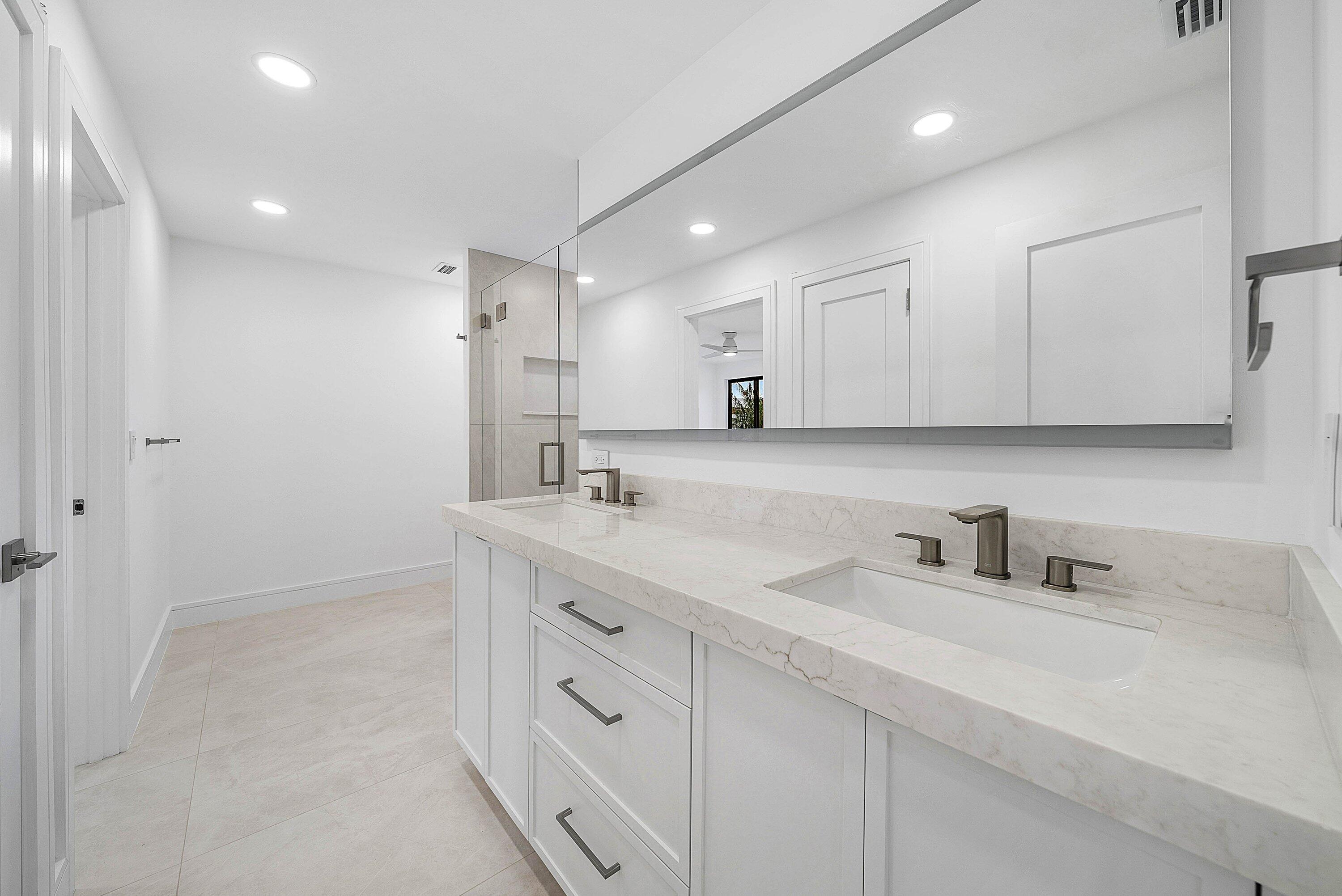 6547 Via Rosa Boca Raton, FL 33433 - Photo 37 of 55 a bathroom with a double vanity sink mirror and