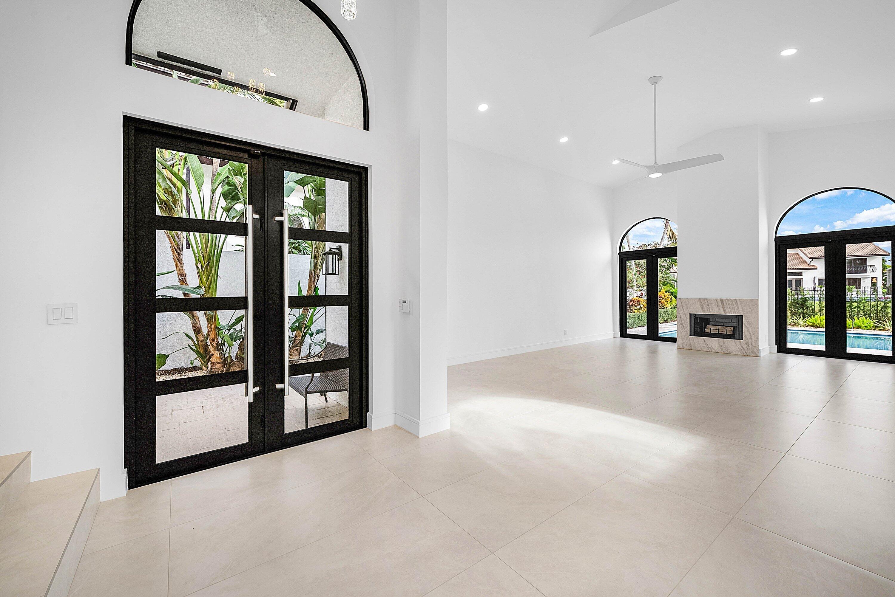 6547 Via Rosa Boca Raton, FL 33433 - Photo 4 of 55 wooden floor in an empty room with a window