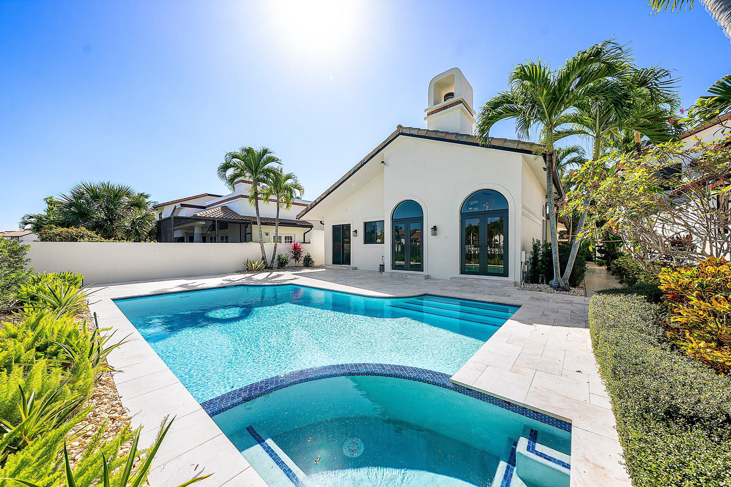 6547 Via Rosa Boca Raton, FL 33433 - Photo 43 of 55 a view of a house with swimming pool and a yard