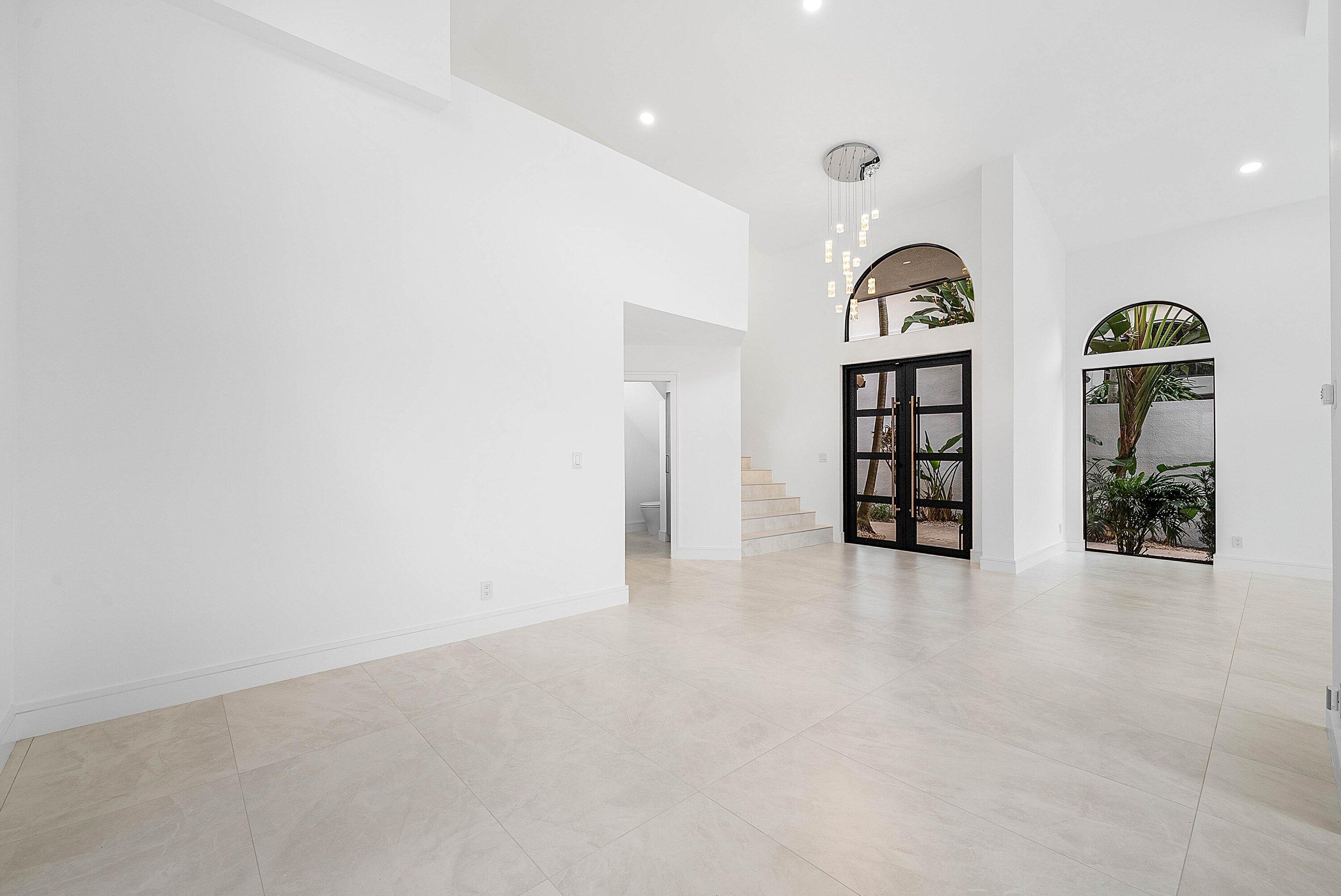 6547 Via Rosa Boca Raton, FL 33433 - Photo 9 of 55 an empty room with windows