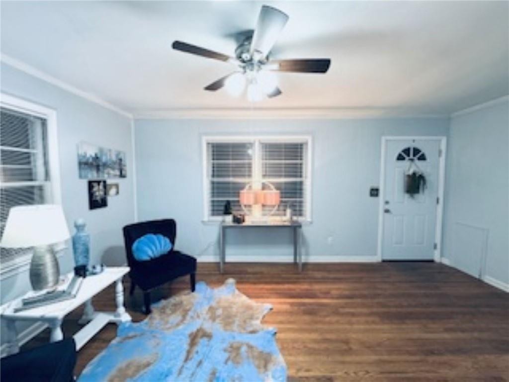 209 Moultrie Lane Southwest Rome, GA 30161 - Photo 16 of 46 a living room with furniture a bed and a potted plant