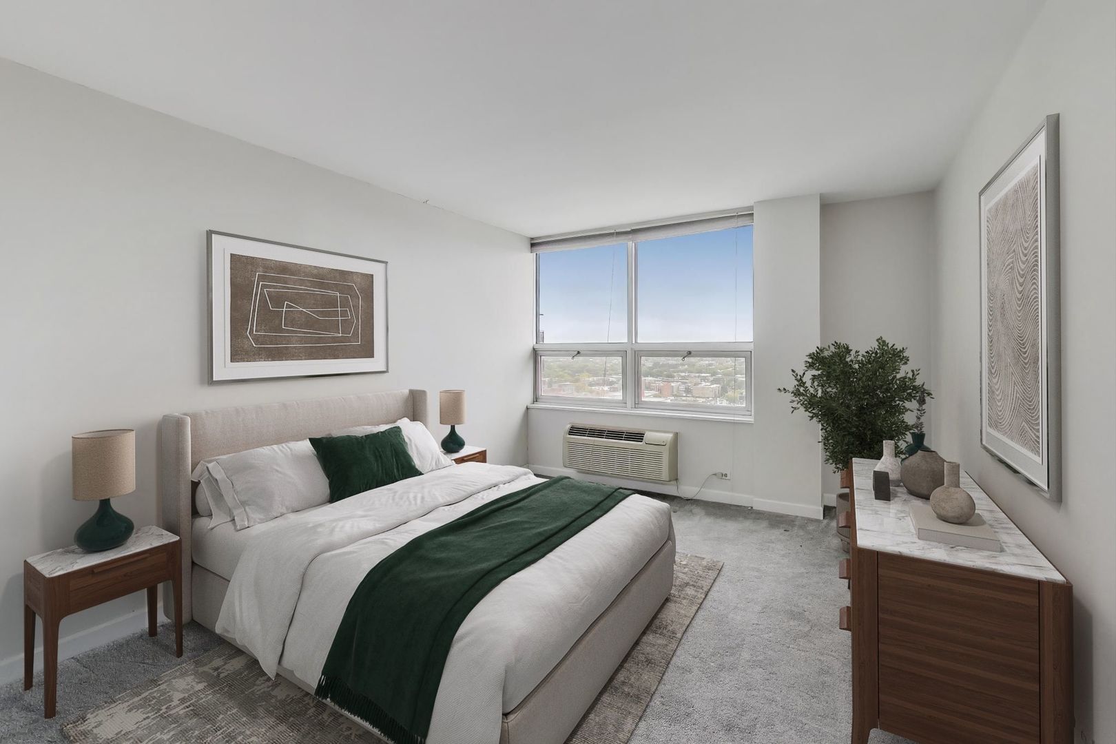 5733 North Sheridan Road, Unit 23B Chicago, IL 60660 - Photo 18 of 33 a bedroom with a large bed and a potted plant