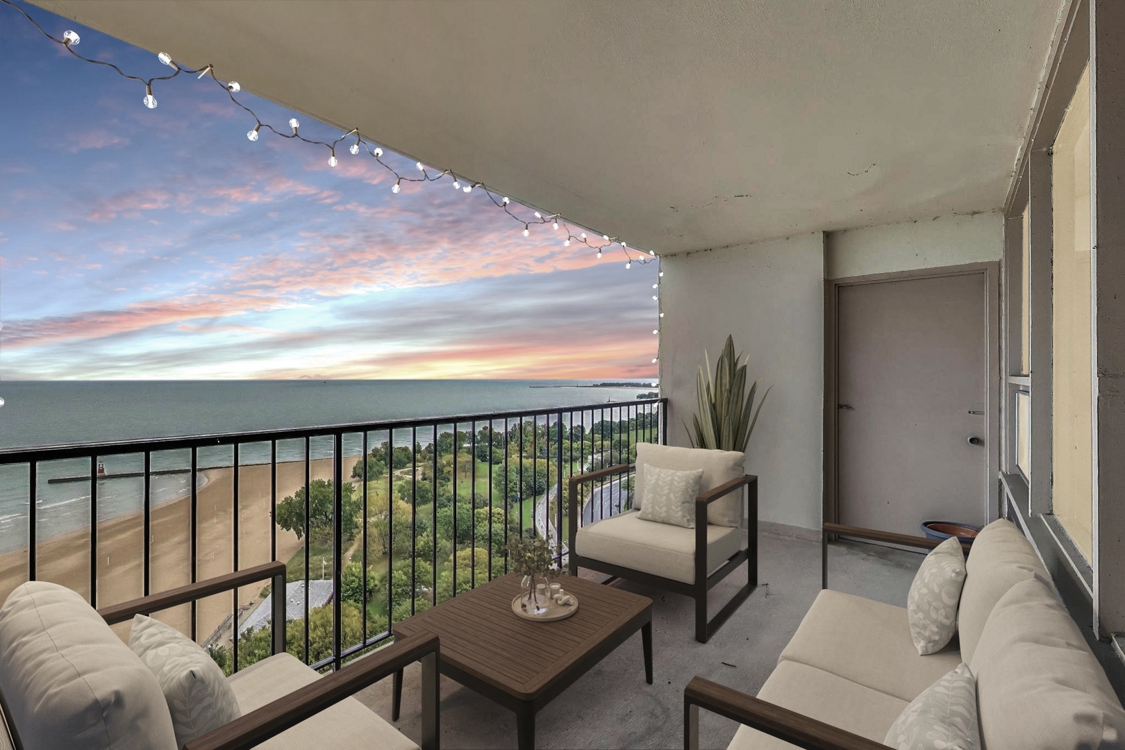 5733 North Sheridan Road, Unit 23B Chicago, IL 60660 - Photo 22 of 33 a balcony with furniture and a potted plant