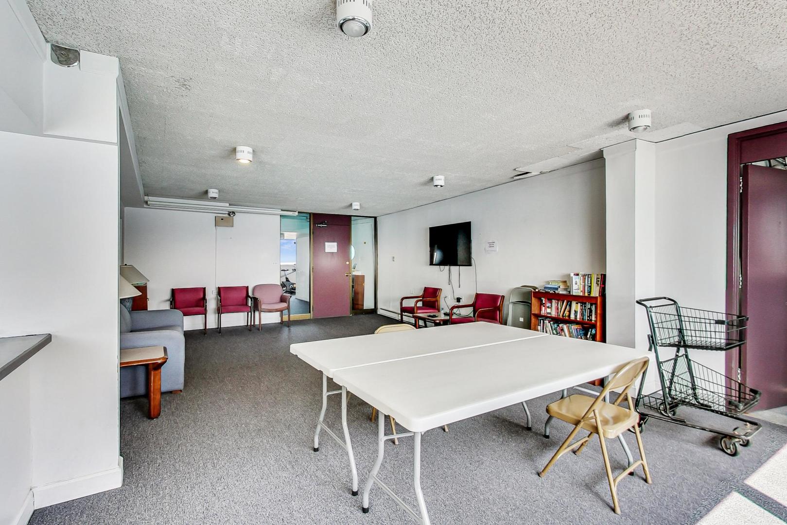 5733 North Sheridan Road, Unit 23B Chicago, IL 60660 - Photo 26 of 33 a view of a livingroom with furniture and a table