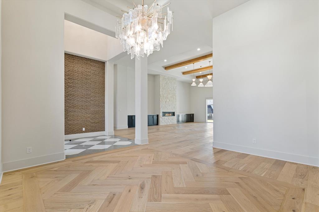 312 Longview Place Heath, TX 75032 - Photo 13 of 40 a view of an empty room with a chandelier
