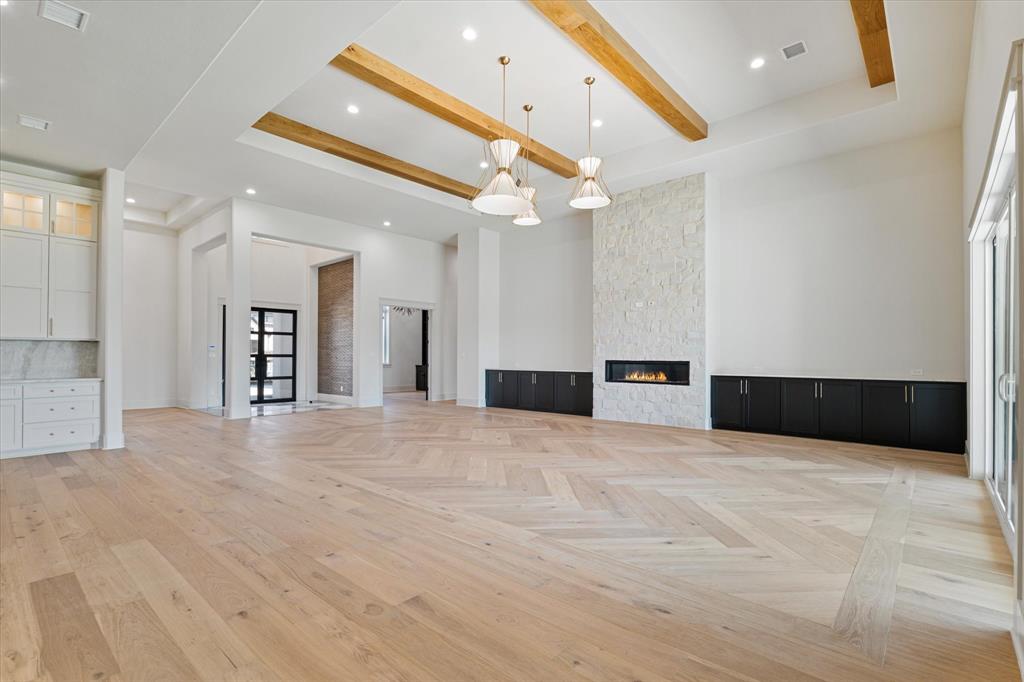 312 Longview Place Heath, TX 75032 - Photo 18 of 40 a view of an empty room with a kitchen