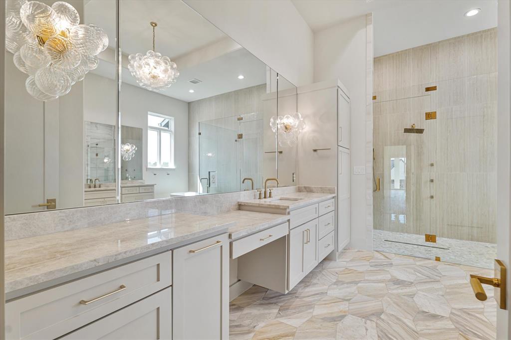 312 Longview Place Heath, TX 75032 - Photo 27 of 40 a spacious bathroom with a granite countertop double vanity and a mirror