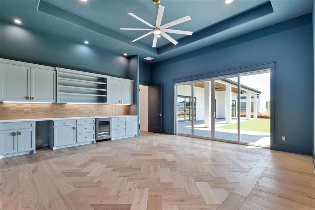 312 Longview Place Heath, TX 75032 - Photo 33 of 40 a view of an empty room with a window and a kitchen