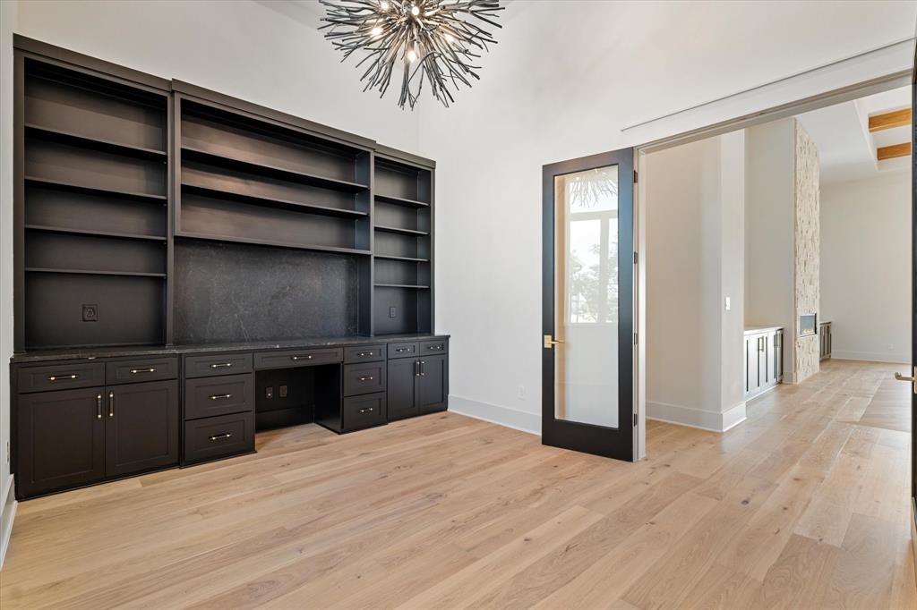 312 Longview Place Heath, TX 75032 - Photo 35 of 40 a bedroom with a bed and a cabinets