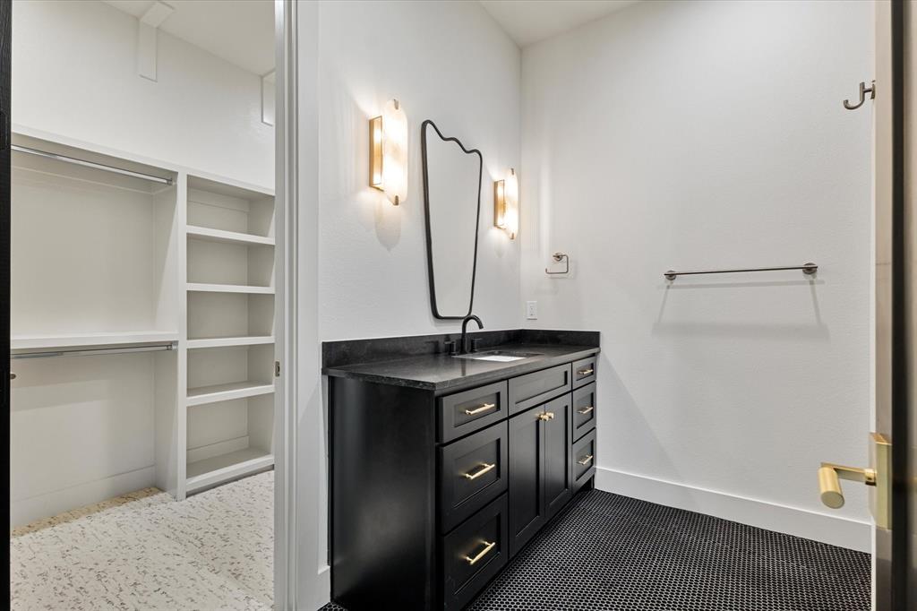312 Longview Place Heath, TX 75032 - Photo 38 of 40 a kitchen with a sink and a refrigerator