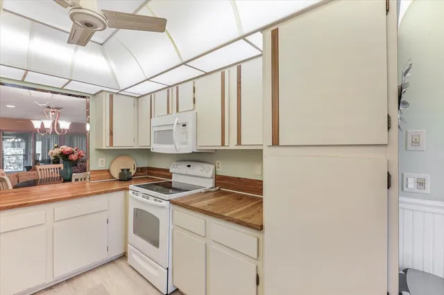 a kitchen with a sink cabinets and window