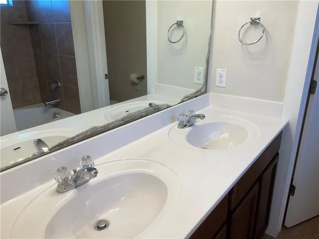 a bathroom with a sink and a mirror