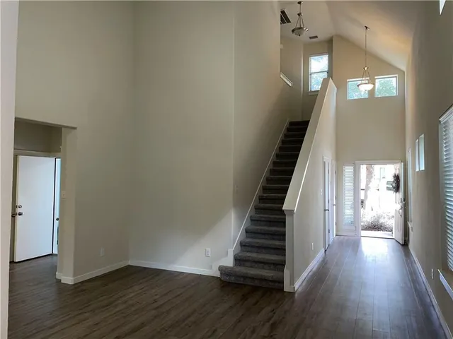 a view of entryway with wooden floor