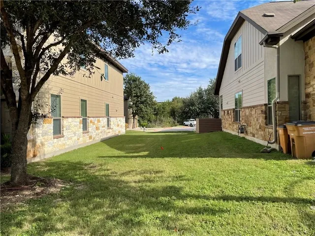 a porch with a table and chairs in patio