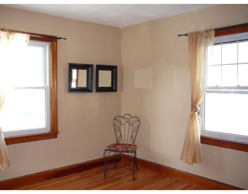 105 Redlands Street Springfield, MA 01104 - Photo 12 of 18 a chair and a table in a room