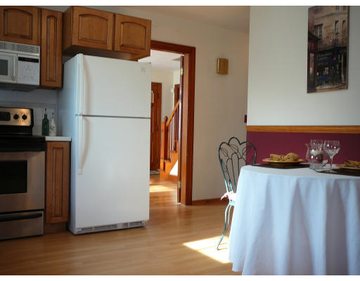 105 Redlands Street Springfield, MA 01104 - Photo 8 of 18 a kitchen with a refrigerator and a stove