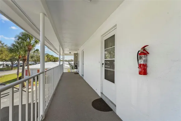 a view of a hallway with stairs