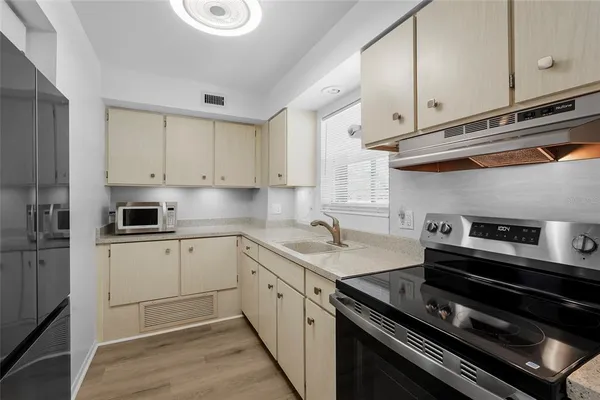 a kitchen with a stove and a sink
