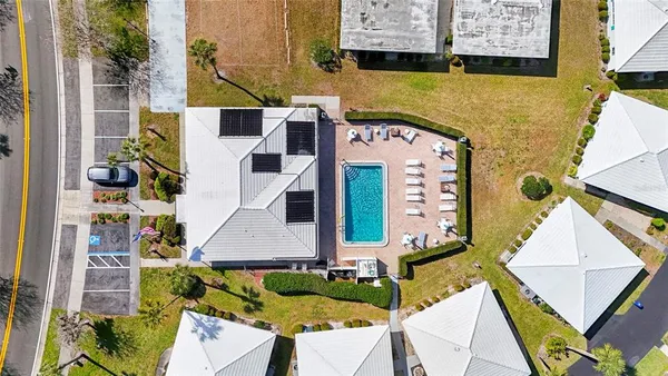 an aerial view of a house with swimming pool