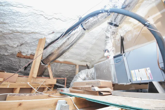 a view of living room with furniture and a mirror