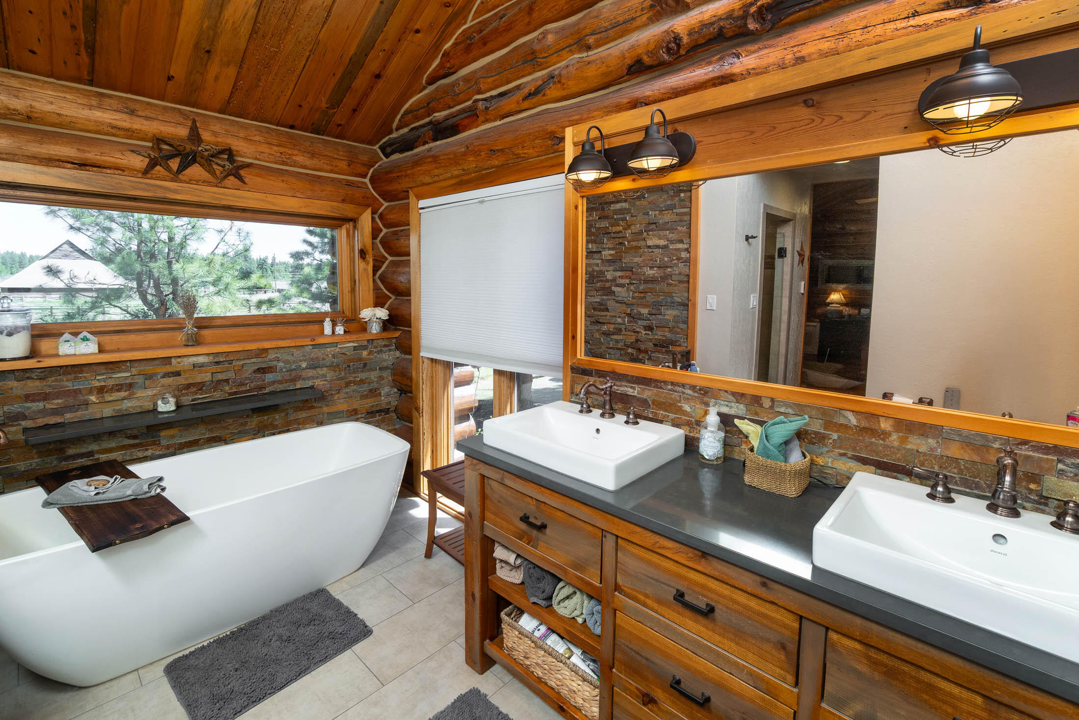 32907 River Bend Road Chiloquin, OR 97624 - Photo 12 of 83 a bathroom with a tub sink and mirror