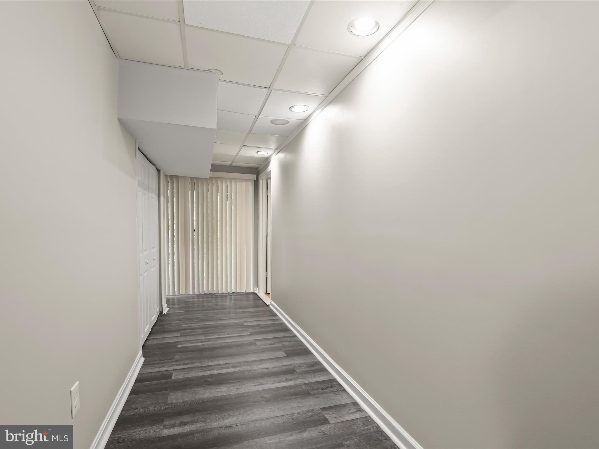 3754 Foxford Stream Road Nottingham, MD 21236 - Photo 14 of 22 a view of a hallway with wooden floor