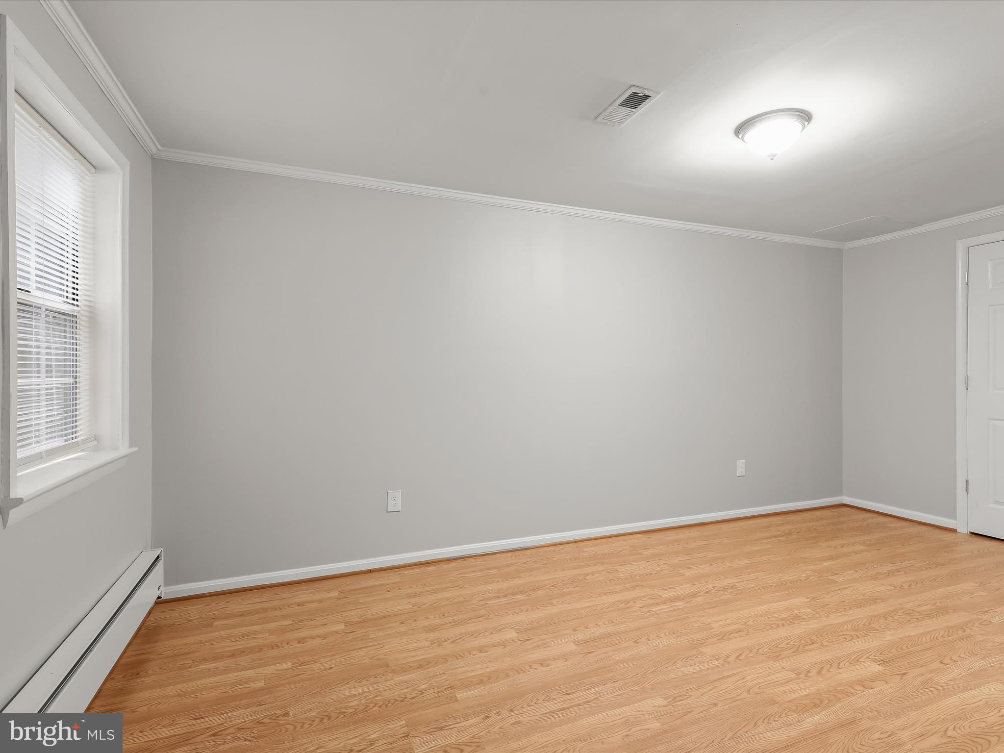 3754 Foxford Stream Road Nottingham, MD 21236 - Photo 15 of 22 wooden floor in an empty room with a window