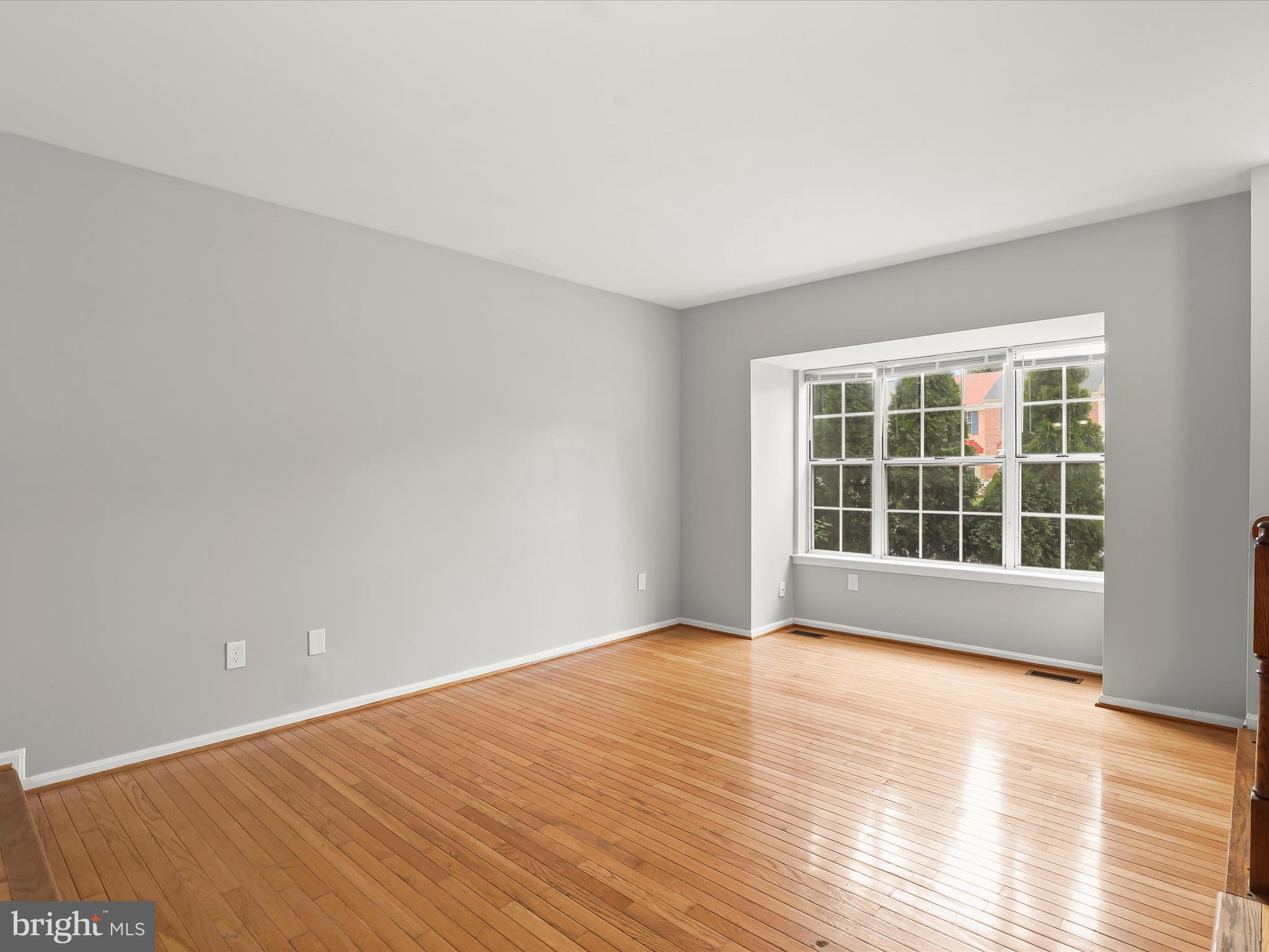 3754 Foxford Stream Road Nottingham, MD 21236 - Photo 3 of 22 a view of an empty room with wooden floor and windows