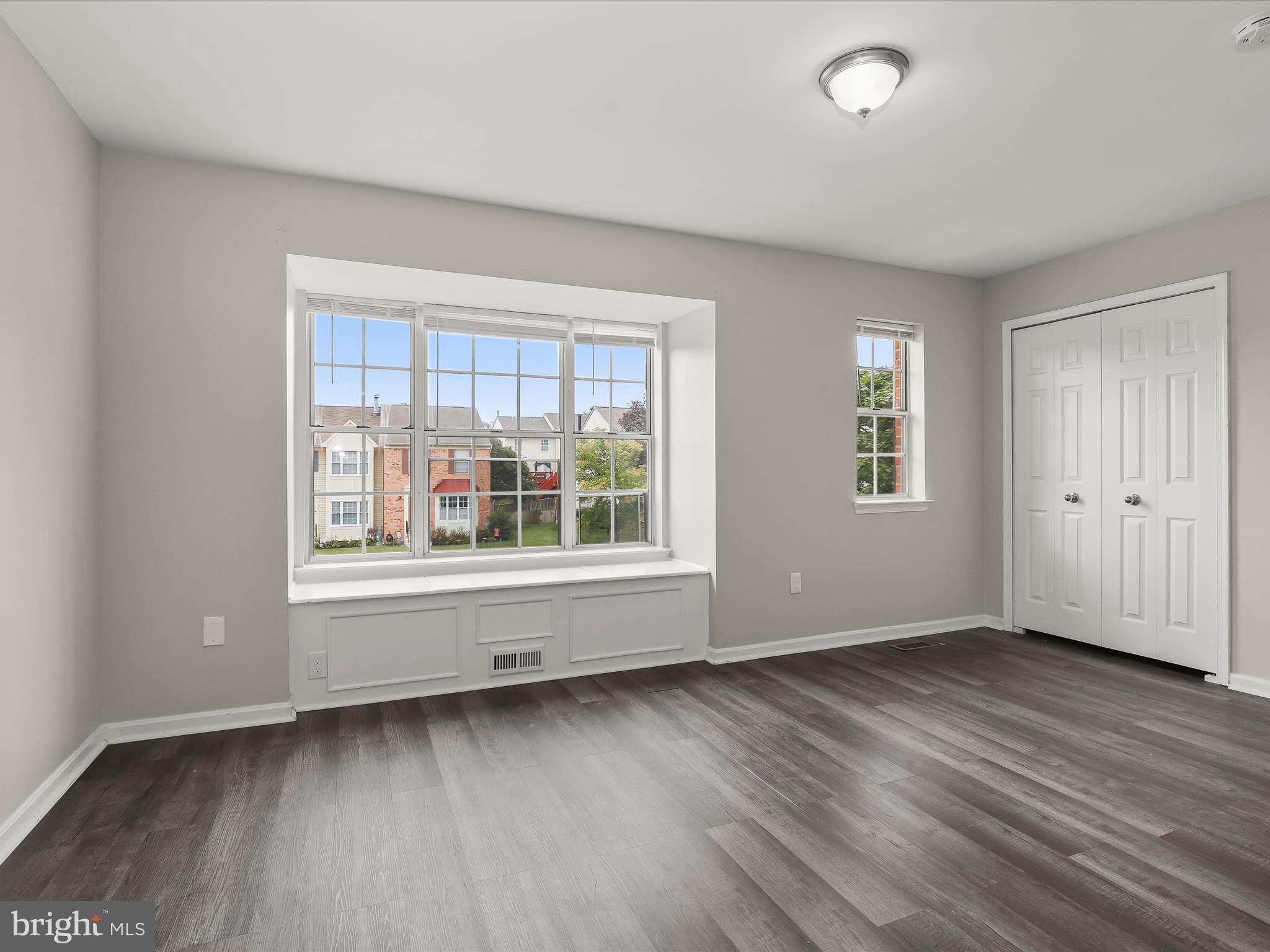 3754 Foxford Stream Road Nottingham, MD 21236 - Photo 9 of 22 an empty room with wooden floor and windows