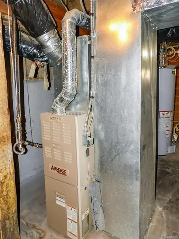 a view of a house with snow on the road