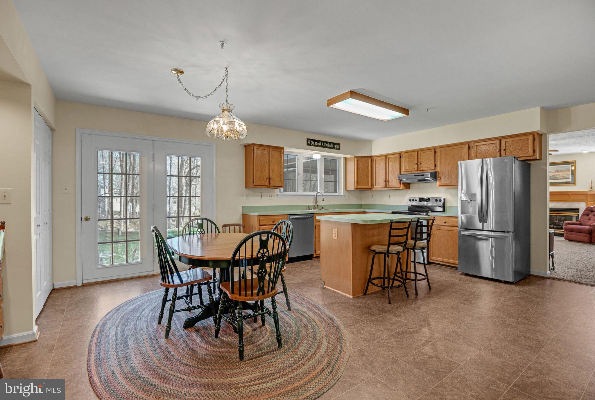 540 Small Reward Road Huntingtown, MD 20639 - Photo 10 of 26 a view of a dining room with furniture window and outside view