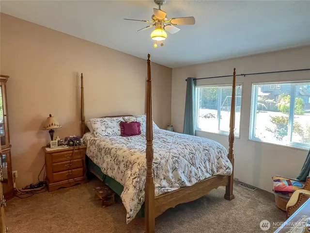 a room with a bed and a chandelier